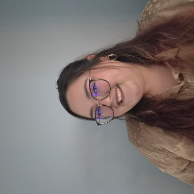 T.