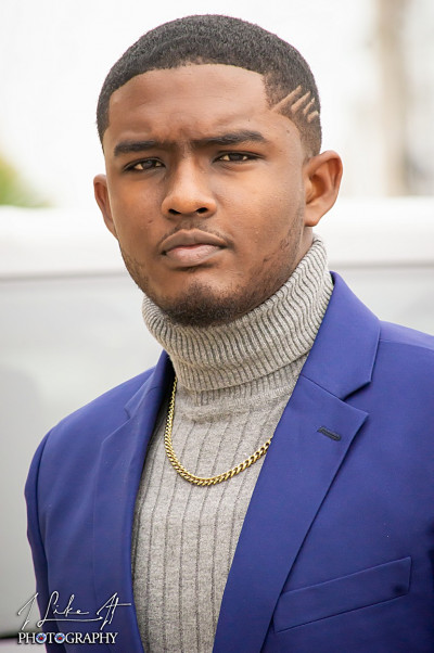 J.